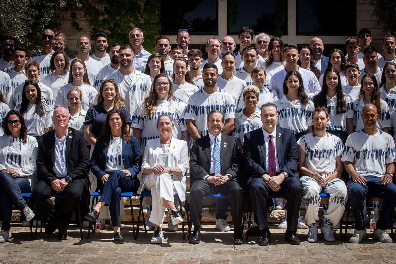 Israeli President Isaac Herzog (center), Olympic Committee of Israel head Yael Arad (third from left) and Minister of Culture and Sports Miki Zohar (third from right) host the Olympic and Paralympic delegations at the President's Residence in Jerusalem, June 19, 2024. Photo by Oren Ben Hakoon/Flash90.