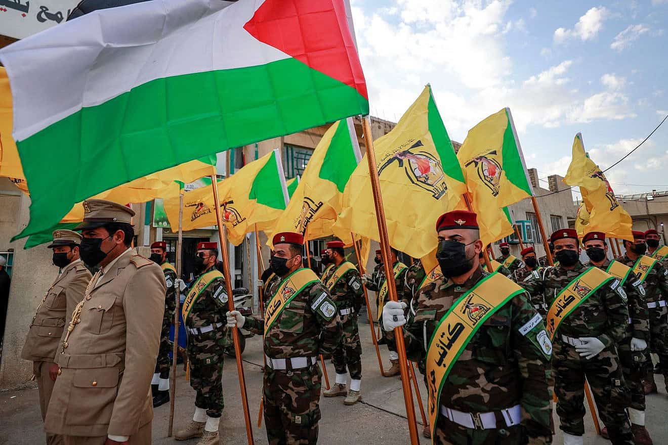 Members of Kata’ib Hezbollah attend the funeral in Baghdad of Fadel al-Maksusi, a terrorist who was also part of the Islamic Resistance in Iraq, on Nov. 21, 2023. Photo by Ahmad al-Rubaye/AFP via Getty Images.
