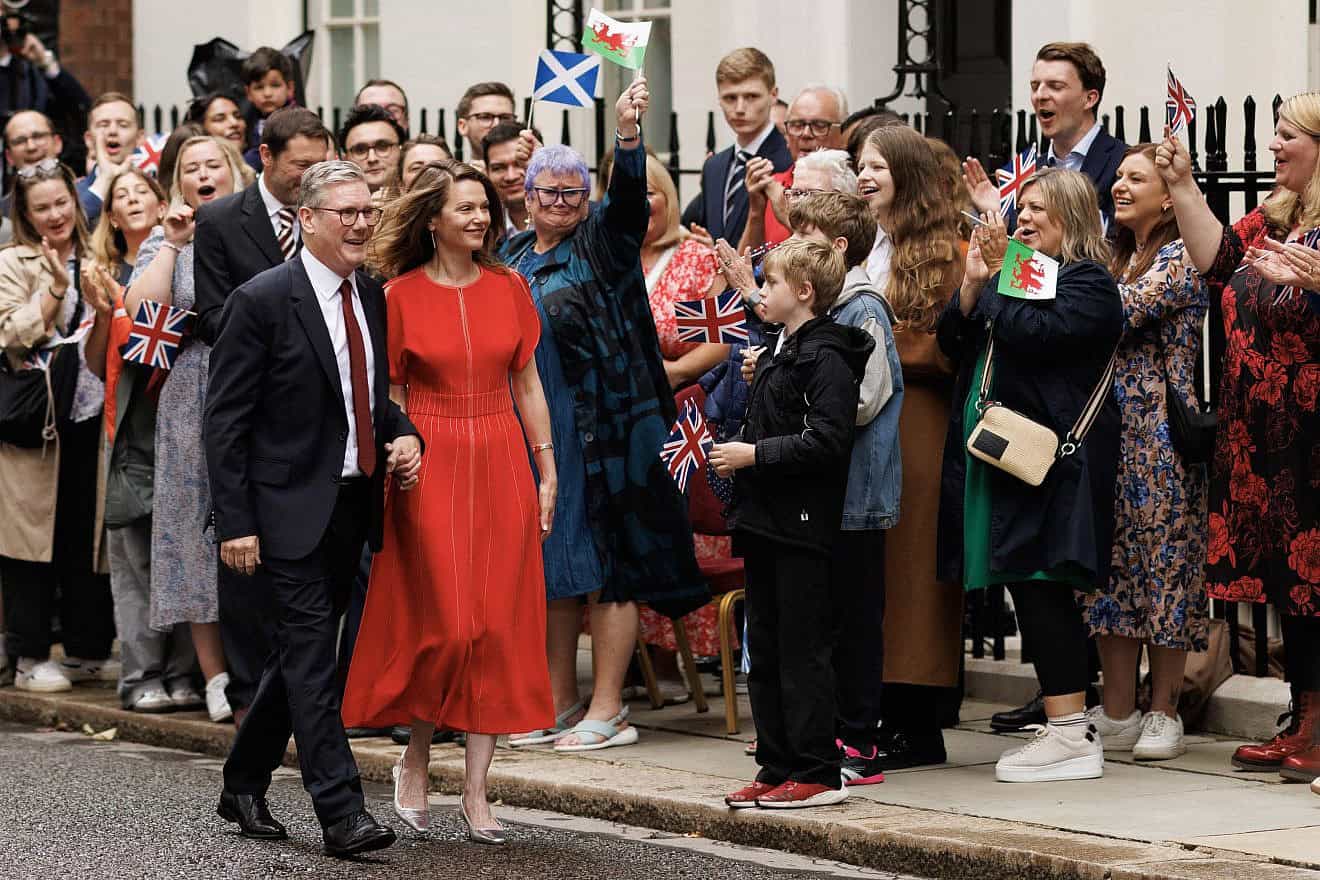 Labour Party leader and incoming prime minister, Keir Starmer, and wife Victoria greet supporters as they enter 10 Downing Street in London following a landslide election victory in the United Kingdom on July 5, 2024. Photo by Dan Kitwood/Getty Images.