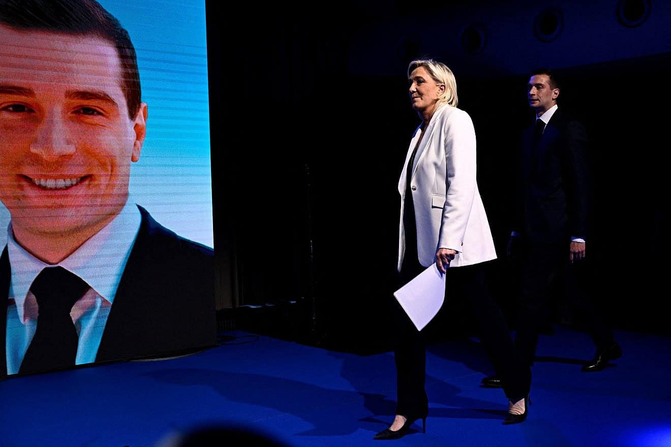 French far-right Rassemblement National Rally Party leader Marine Le Pen, followed by party president Jordan Bardella, arrives on stage during an evening gathering on the final day of the European Parliament election, at the Pavillon Chesnaie du Roy in Paris, on June 9, 2024. Photo by Julien De Rose/AFP via Getty Images.