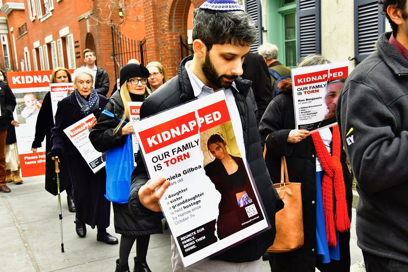 Every Shabbat afternoon since Nov. 4, pro-Israel Manhattan residents have marched for about 45 minutes carrying signs drawing attention to the hostages whom Hamas holds in the Gaza Strip. Photo by Phillip Maier.