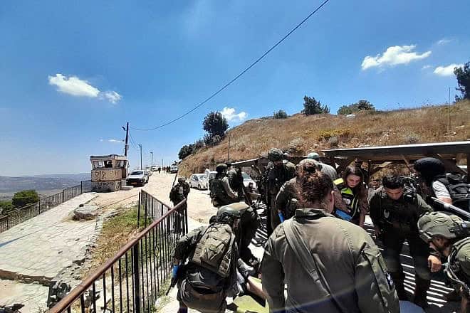 Israel Defense Forces troops at the scene of a terrorist shooting at the Mitzpe Yosef outpost on Mount Gerizim near Nablus (Shechem) in Samaria, July 2, 2024. Credit: Menachem Ben Shachar/Samaria Regional Council.