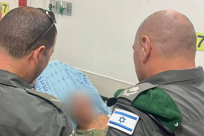 The wounded Israeli Border Police officer recovering in the hospital after being stabbed by a Gazan terrorist during a counterterror operation in al-Bira in Samaria on July 15, 2024. Credit: Israel Police.