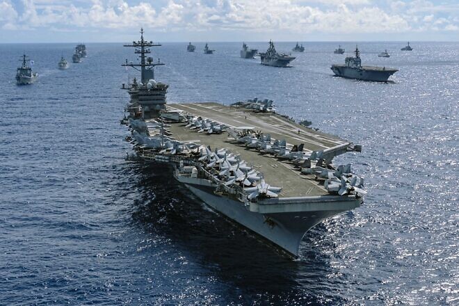 The “USS Abraham Lincoln” sails in formation with other vessels in the Pacific Ocean, July 28, 2022, in support of Rim of the Pacific, the world’s largest international maritime exercise. Credit: Canadian Armed Forces Cpl. Djalma Vuong-De Ramos, via U.S. Department of Defense.
