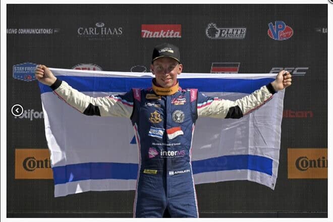 Israeli race car driver Ariel Elkin, 17, on the podium at the USF Juniors Championship Formula 4 race, April 2024. Photo by Gavin Baker Photography.