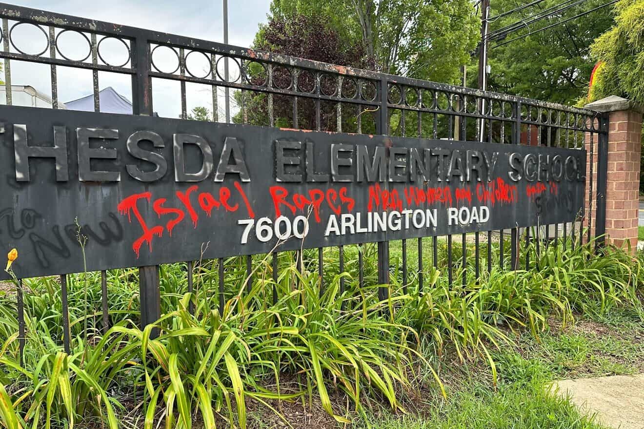 Anti-Israel graffiti was spray-painted in red on the main sign of Bethesda Elementary School in Maryland, August 2024. Credit: Courtesy of the Anti-Defamation League.
