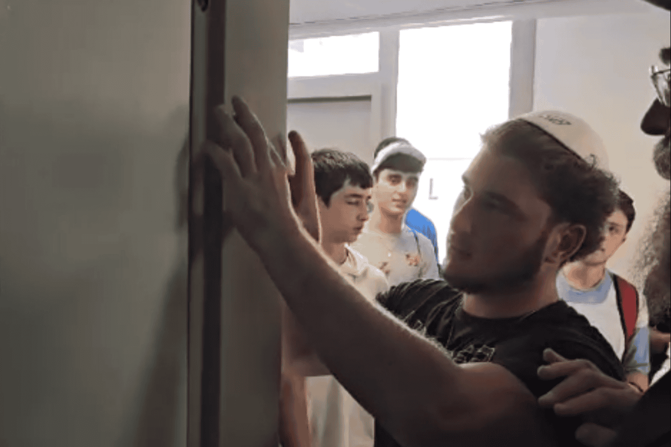 Jewish teens affix mezuzahs while visiting the Ramon Air Base in southern Israel in July 2024. Credit: Courtesy of CTeen.