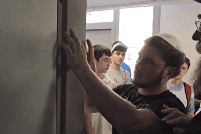 Jewish teens affix mezuzahs while visiting the Ramon Air Base in southern Israel in July 2024. Credit: Courtesy of CTeen.