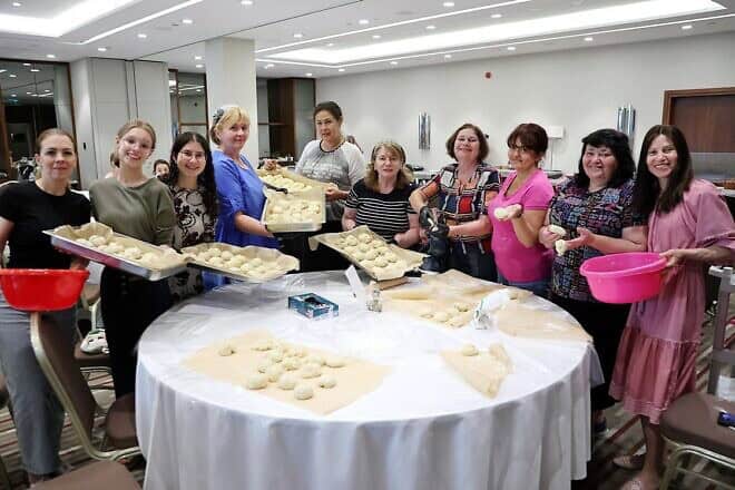 Women baked challah during a summer experience in Poland for 200 Jewish Ukrainians from Aug. 15-27, 2024. Credit: R. Vilenskyi/Chabad of Poland.