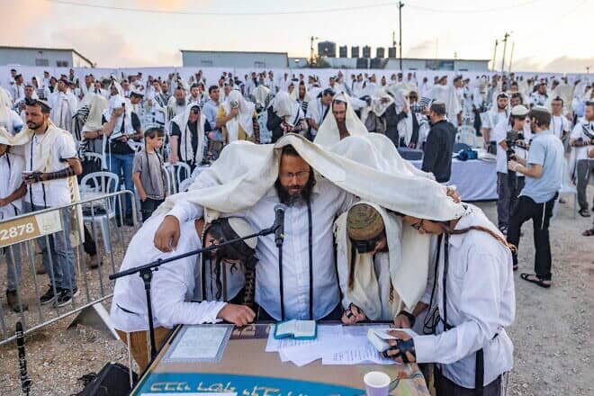 Jews pray at the newly recognized community of Evyatar in Samaria, July 7, 2024. Photo by Chaim Goldberg/Flash90.