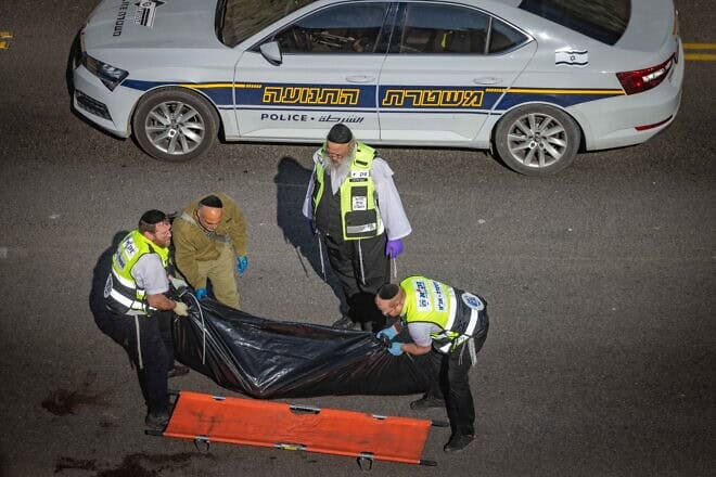 Security and rescue personnel at the scene of a terrorist attack on Route 1 near Ma'ale Adumim, on Feb. 22, 2024. Photo by Chaim Goldberg/Flash90.