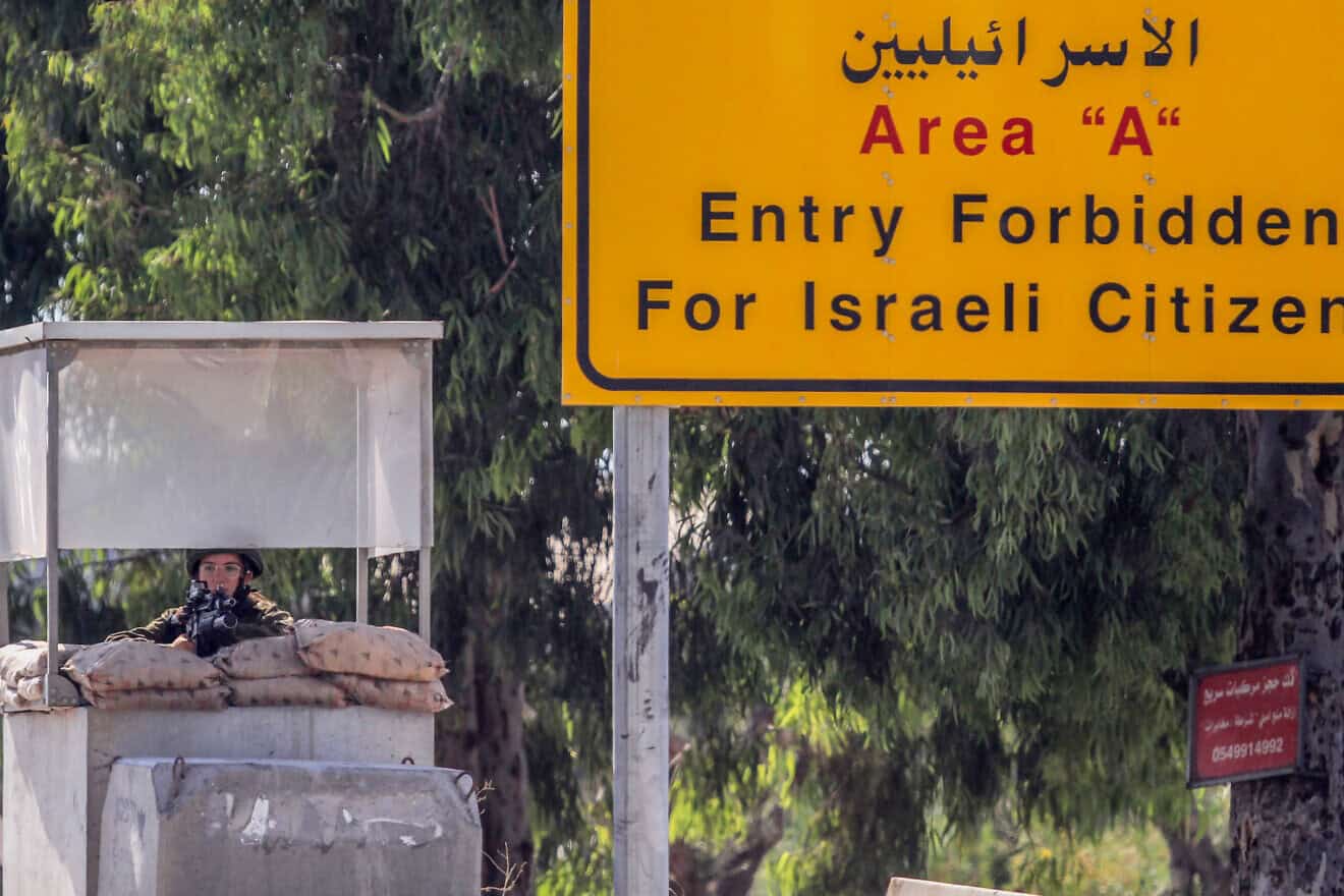 Israeli soldiers guard the entrance to the western Samaria city of Qalqilya, following a suspect shooting attack, June 22, 2024. Photo by Nasser Ishtayeh/Flash90.