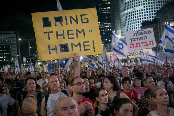 A protest against Prime Minister Benjamin Netanyahu's government and for a deal to release Israelis held hostage in Gaza, near the Kirya military headquarters in Tel Aviv, Aug. 10, 2024. Photo by Miriam Alster/Flash90.