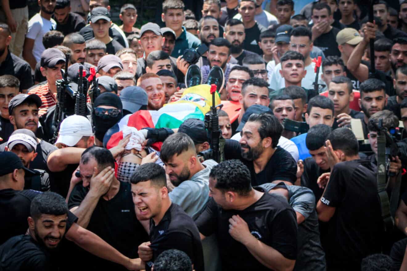 Palestinian gunmen and mourners take part in the funeral of Palestinians kiiled in an Israeli drone attack, in the Balata refugee camp, on Aug. 15, 2024. Photo by Nasser Ishtayeh/Flash90.