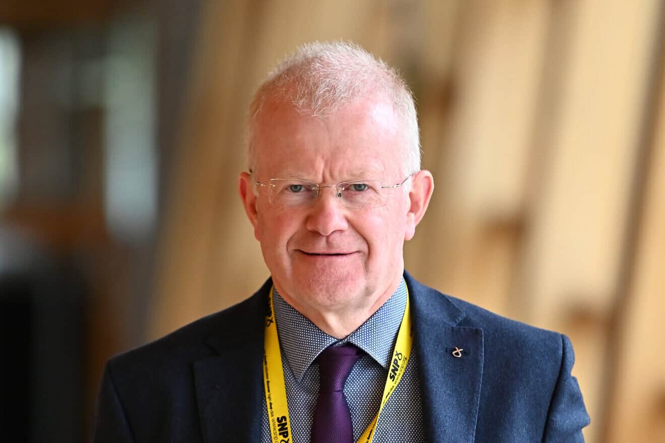 SNP MSP John Mason on the way to the chamber of the Scottish Parliament as MSPs return for the new parliamentary term in Edinburgh, Scotland, on Sept. 6, 2022. Photo by Ken Jack/Getty Images.