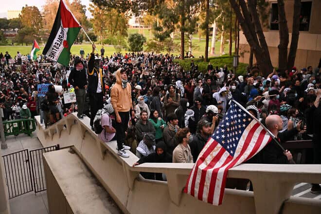 Police officers clear pro-Palestinian demonstrators off the campus stairs after students occupied the Physical Sciences Lecture Hall at the University of California, Irvine, in Irvine, Calif., on May 15, 2024. Photo by Patrick T. Fallon/AFP via Getty Images.