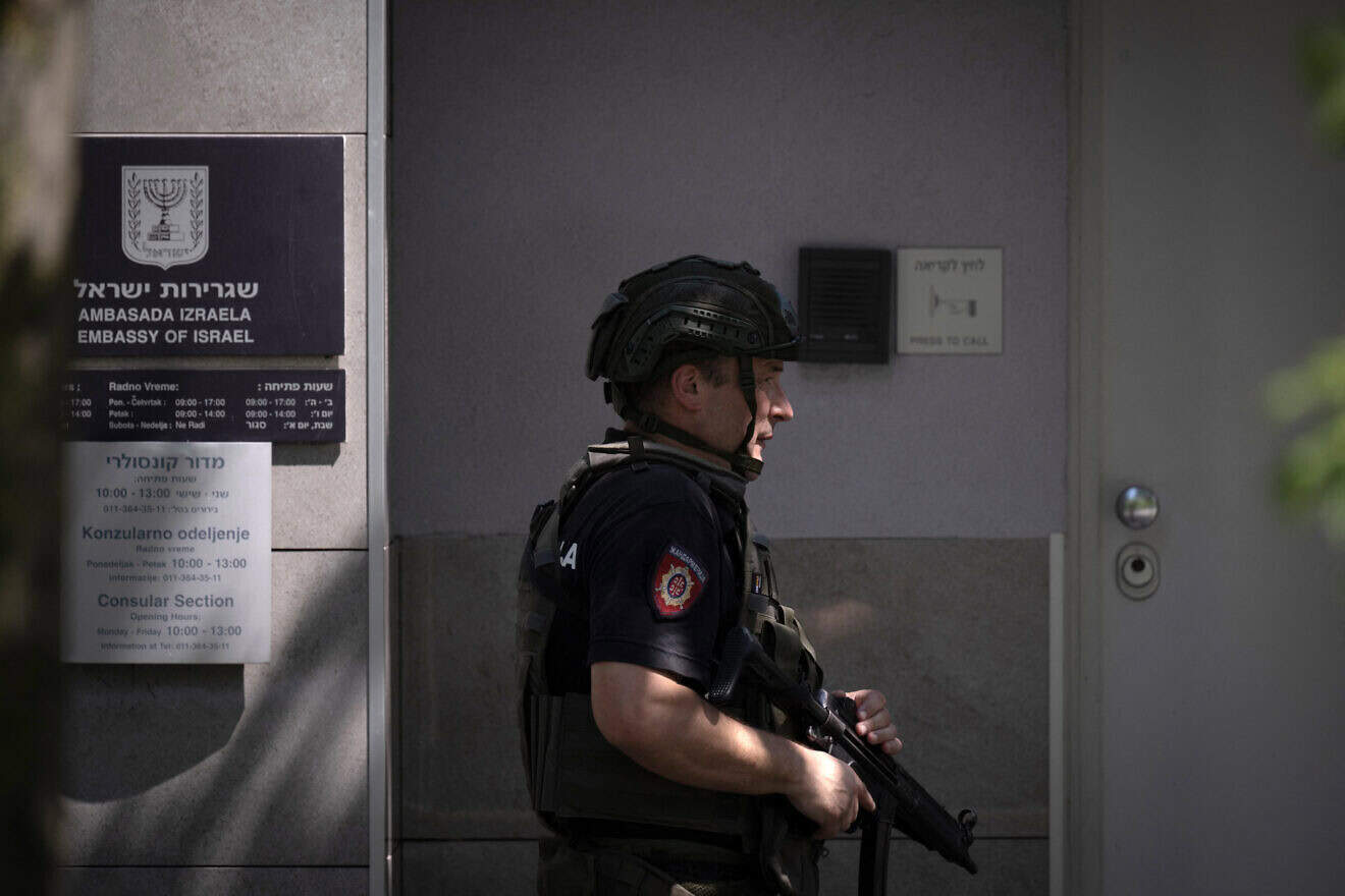 A police officer stationed in front of the Israeli embassy in Belgrade following an attack in the area, June 29, 2024. Photo by Oliver Bunic/AFP via Getty Images.
