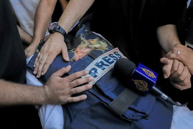 Mourners surround the body of Hamas terrorist and “Al Jazeera” reporter Ismail al-Ghoul, July 31, 2024. Photo by Abood Abusalama/Middle East Images via AFP.