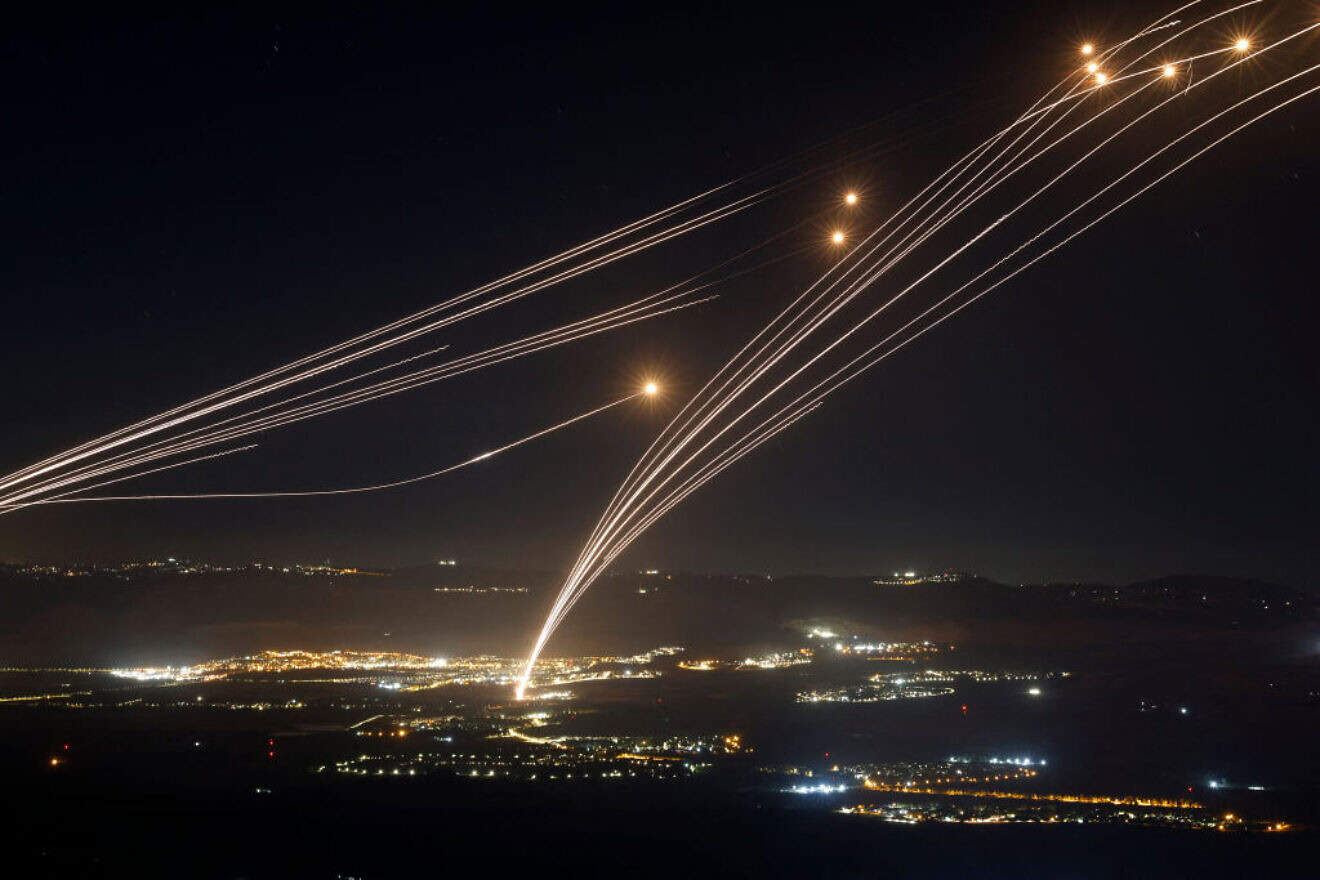 Rockets fired from Southern Lebanon are intercepted by Israel's Iron Dome air defense system over the Upper Galilee region in northern Israel, on Aug. 4, 2024. Photo by Jalaa Marey/AFP via Getty Images.