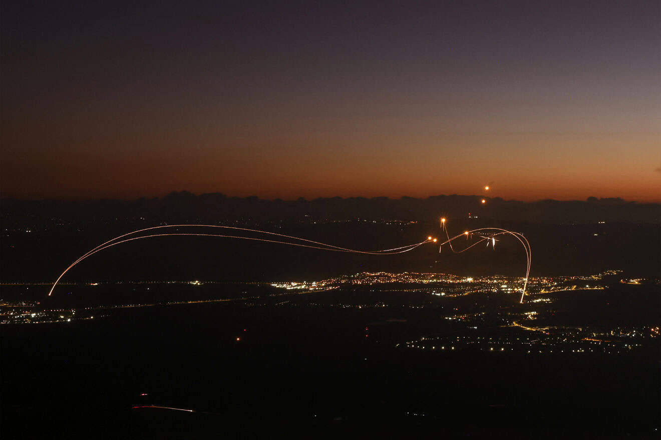 Rockets fired from Southern Lebanon are intercepted by Israel's Iron Dome air-defense system over the Upper Galilee region in northern Israel on Aug. 23, 2024. Photo by Jalaa Marey/AFP via Getty Images.