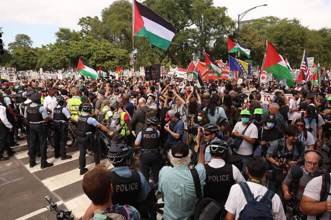 Police and demonstrators prepare for start of the "March on the DNC" during the first day of the Democratic National Convention in Chicago on Aug. 19, 2024. Photo by Scott Olson/Getty Images.
