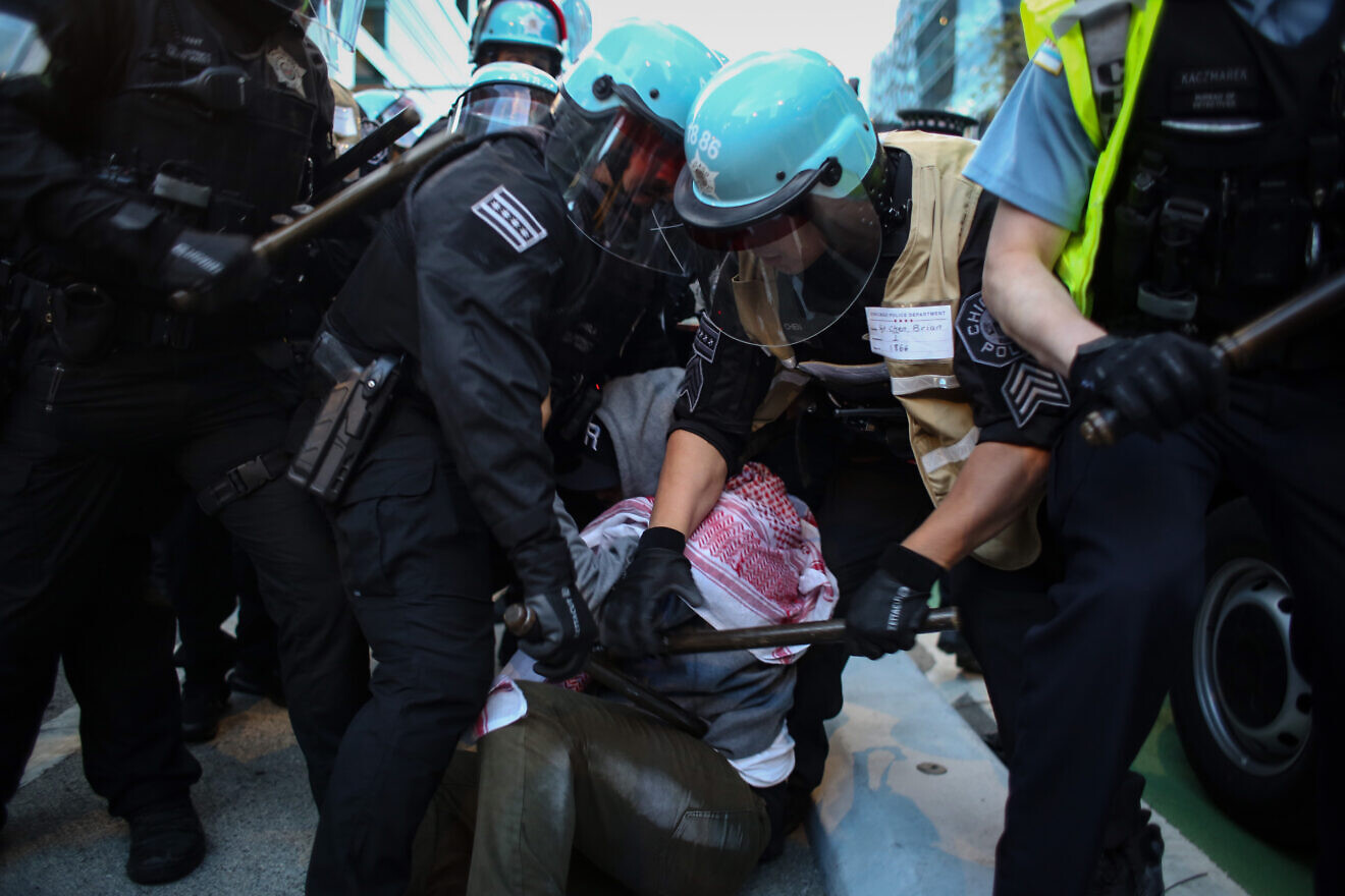 Chicago police officers arrest anti-Israel protesters near the Israeli consulate during the Democratic National Convention on Aug. 20, 2024 in Chicago. Photo by Jim Vondruska/Getty Images.