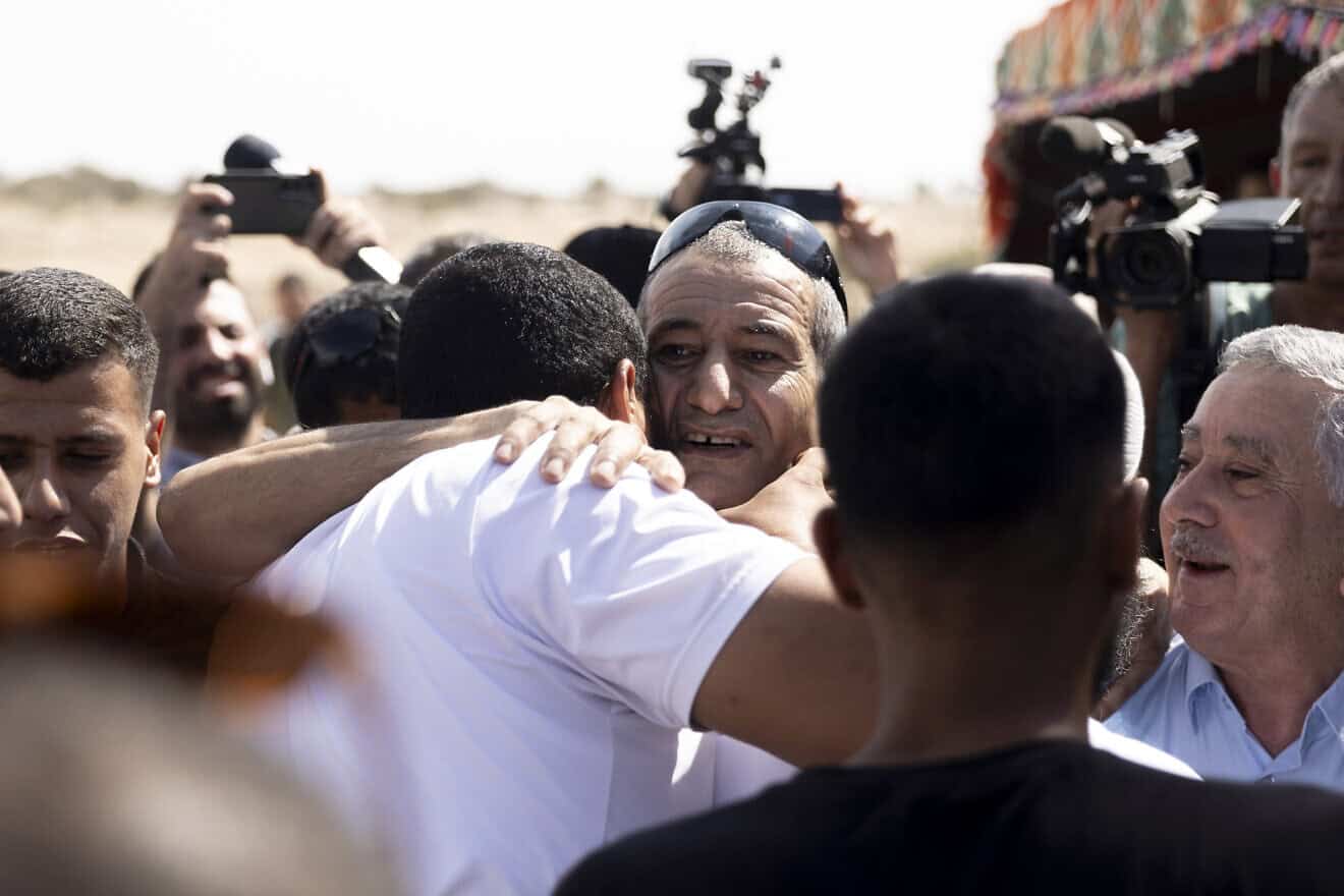 Qaid Farhan Alkadi (center), who was held hostage by Hamas in Gaza, is greeted as he returns to the unrecognized Bedouin village of Carcur, near the city of Rahat, after being rescued by Israeli forces from a tunnel in Southern Gaza, Aug. 28, 2024. Photo by Amir Levy/Getty Images.