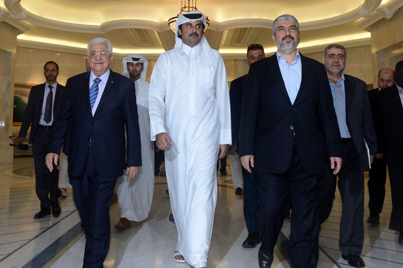 From left: P.A. President Mahmoud Abbas, the Emir of Qatar Sheikh Tamim and Hamas leader Khaled Meshal on Aug. 21, 2014 in Doha, Qatar. Photo by Thaer Ghanaim/PPO via Getty Images.