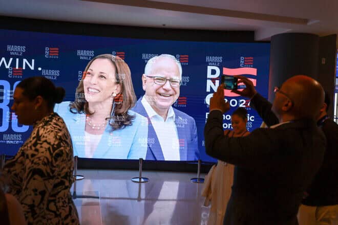 A sign featuring Democratic presidential candidate Vice President Kamala Harris and vice-presidential candidate Minnesota Gov. Tim Walz at the United Center in Chicago before the start of the Democratic National Convention, Aug. 16, 2024. Photo by Joe Raedle/Getty Images.