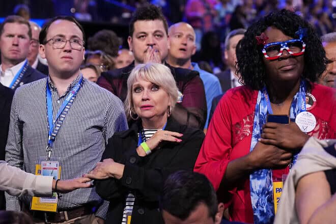 Attendees listen as Jonathan Polin and Rachel Goldberg-Polin, the parents of 23-year-old Israeli-American hostage Hersh Goldberg-Polin, speak on the third day of the Democratic National Convention at the United Center in Chicago on Aug. 21, 2024. Photo by Andrew Harnik/Getty Images.