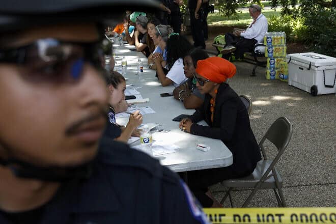 Rep. Ilhan Omar (D-Minn.) is processed by U.S. Capitol Police Officers after being arrested for participating in a sit-in with activists from the Center for Popular Democracy Action (CPDA) in front of the U.S. Supreme Court Building in Washington, D.C., on July 19, 2022. Photo by Anna Moneymaker/Getty Images.