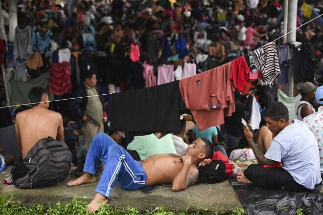 Migrants, mostly from Central America and Venezuela, rest on their way to the United States to escape poverty and violence on the outskirts of Huixtla, Chiapas State, Mexico, on July 24, 2024. Photo by Isaac Guzman/AFP via Getty Images.