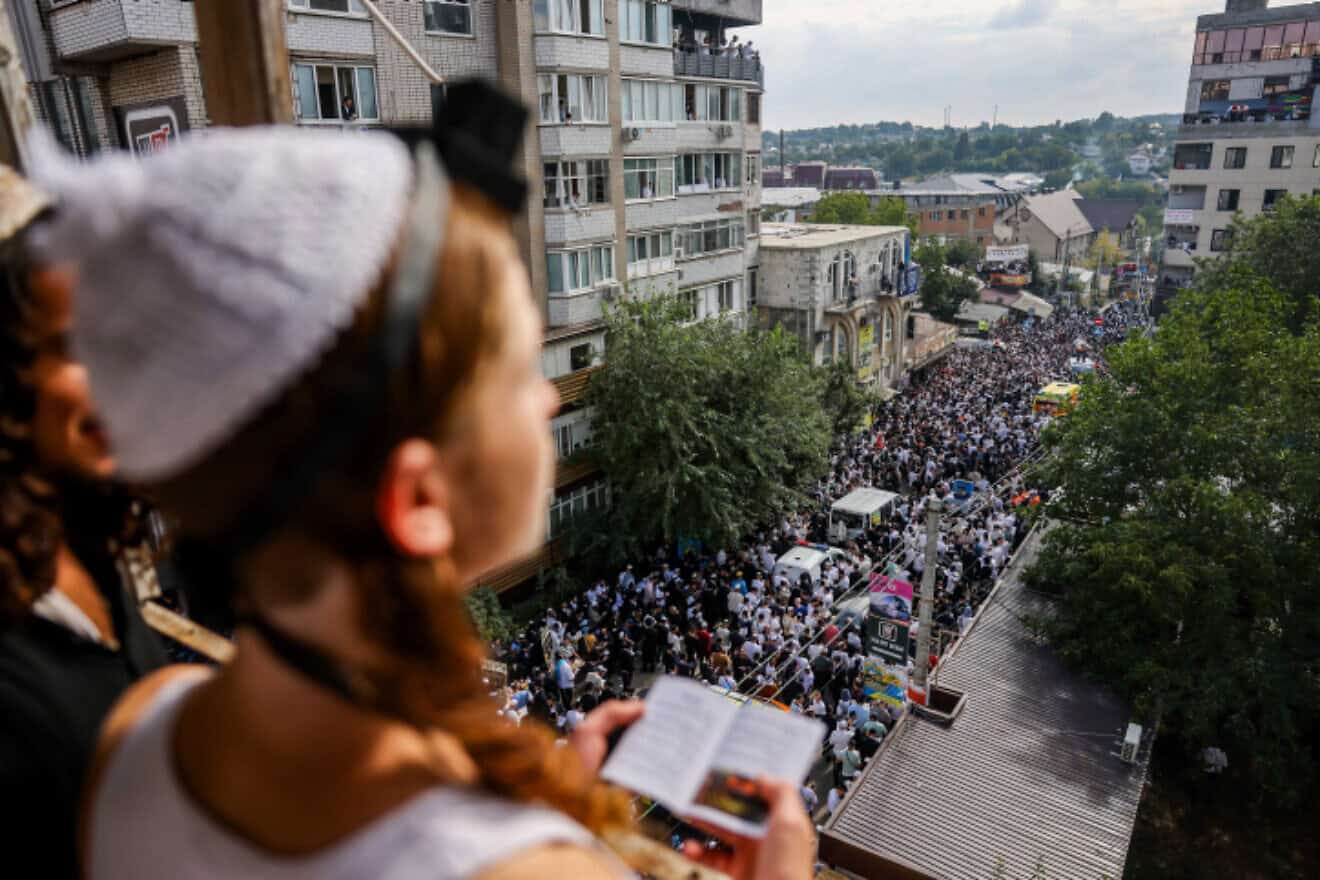 Jewish men in the street during the Tikkun HaKlali recitation of Psalms near the tomb of Rabbi Nachman of Breslov in Uman, Ukraine, on the eve of Rosh Hashanah, Sept.15, 2023. Photo by Chaim Goldberg/Flash90.