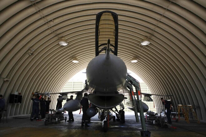 Members of the Israel Defense Forces prepare an F-16 fighter jet at the Ramat David Airbase near Haifa before it leaves for maneuvers above Lebanon. Photo by Nati Shohat/Flash90.