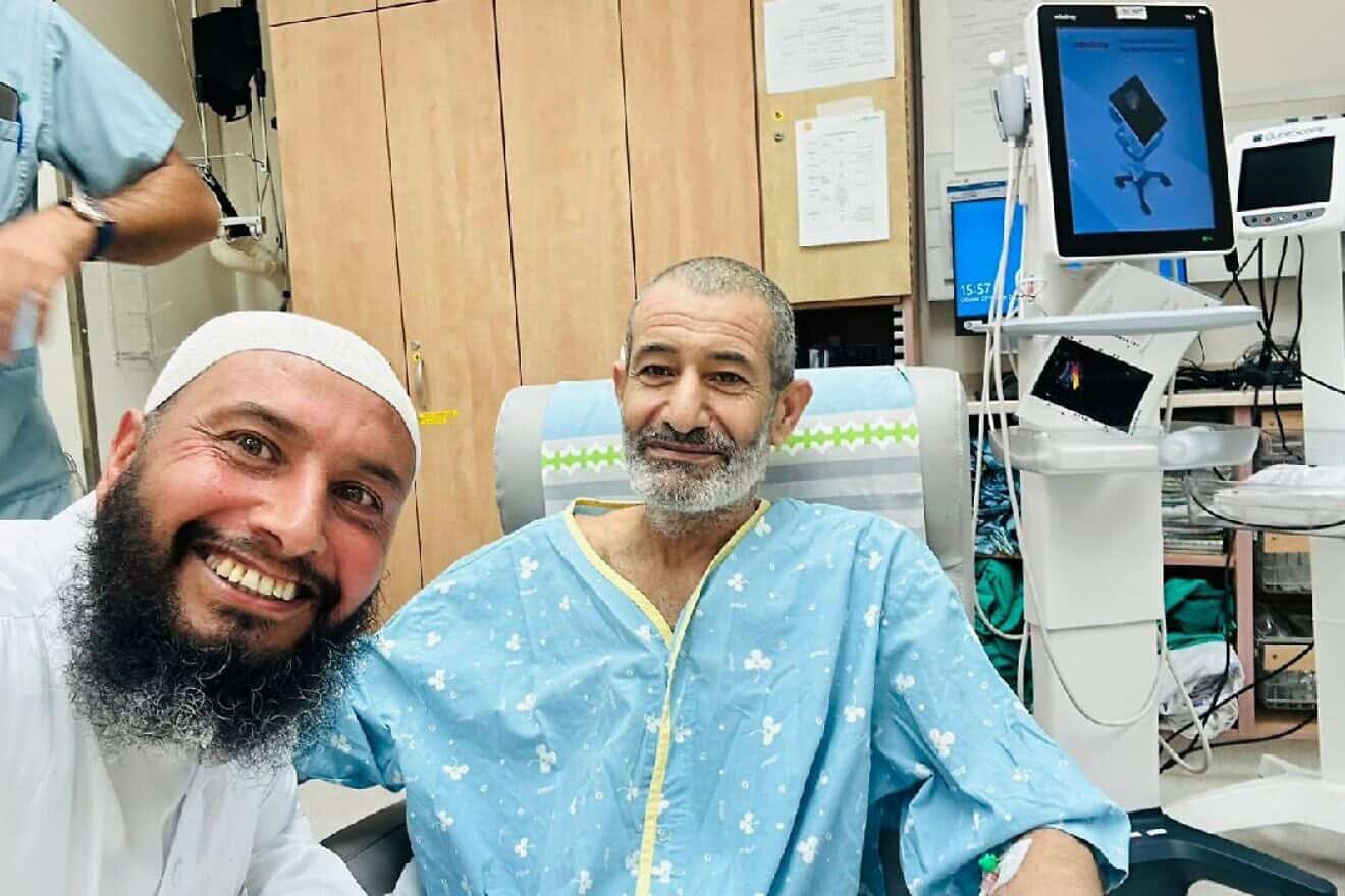 The first image of rescued Israeli hostage Qaid Farhan Alkadi, 52, with a brother at Soroka Medical Center in Beersheva on Aug. 27, 2024. Credit: Courtesy.