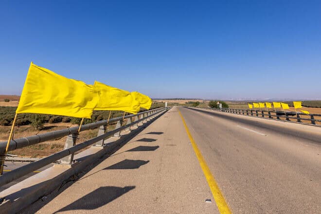 Yellow flags calling for the return of the Israeli hostages who have been held by Hamas terrorists in the Gaza Strip since Oct. 7, 2023, seen on Road 6 on Aug. 4, 2024. Photo by Yossi Aloni/Flash90.