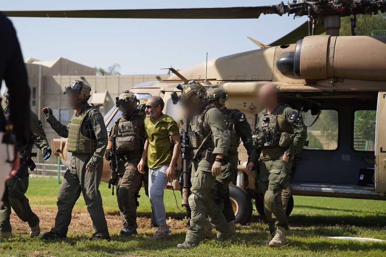Israeli forces escort rescued hostage Qaid Farhan Alkadi from the helicopter to Soroka Medical Center in Beersheva on Aug. 27, 2024. Credit: IDF.