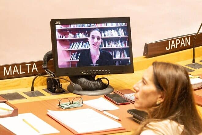 Yuli Novak (on screen), executive director of B'Tselem, briefs the Security Council meeting on the situation in the Middle East, Sept. 4, 2024. Photo by Eskinder Debebe/United Nations.