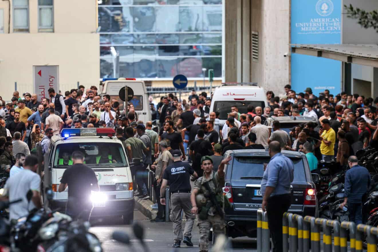 Ambulances are surrounded by people at the entrance to the American University of Beirut Medical Center after explosions hit locations in several Hezbollah strongholds around Lebanon on Sept. 17, 2024. Photo by Anwar Amro/AFP via Getty Images.