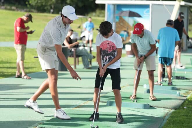 Max Margolis teaches victims of terrorism how to play golf. The Caesarea Golf Club, Sept. 15, 2024. Credit: Meir Pavlovsky.