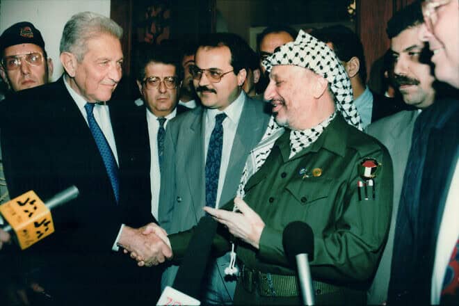 Late Palestinian president Yasser Arafat with late Israeli president Ezer Weizman and Knesset member Ahmad Tibi, in Pretoria, South Africa in 1994. Photo by Moshe Shai/FLASH90.