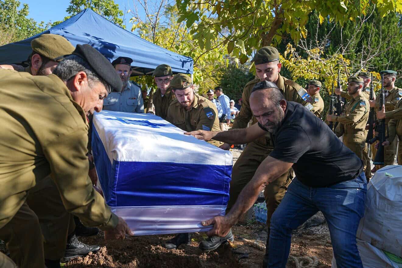 Family and friends mourn at the funeral of Israel Defense Forces Sgt. Ron Sherman, Dec. 15, 2023. Photo by Flash90.