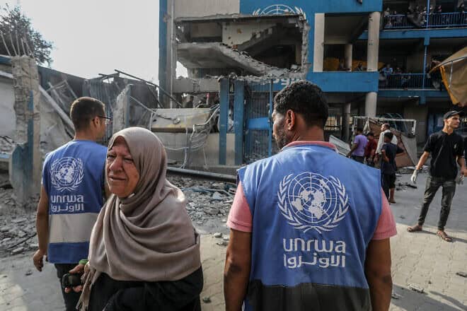 UNRWA officials at the site of an Israeli airstrike in the Nuseirat camp in the central Gaza Strip, July 15, 2024. Photo by Abed Rahim Khatib/Flash90.