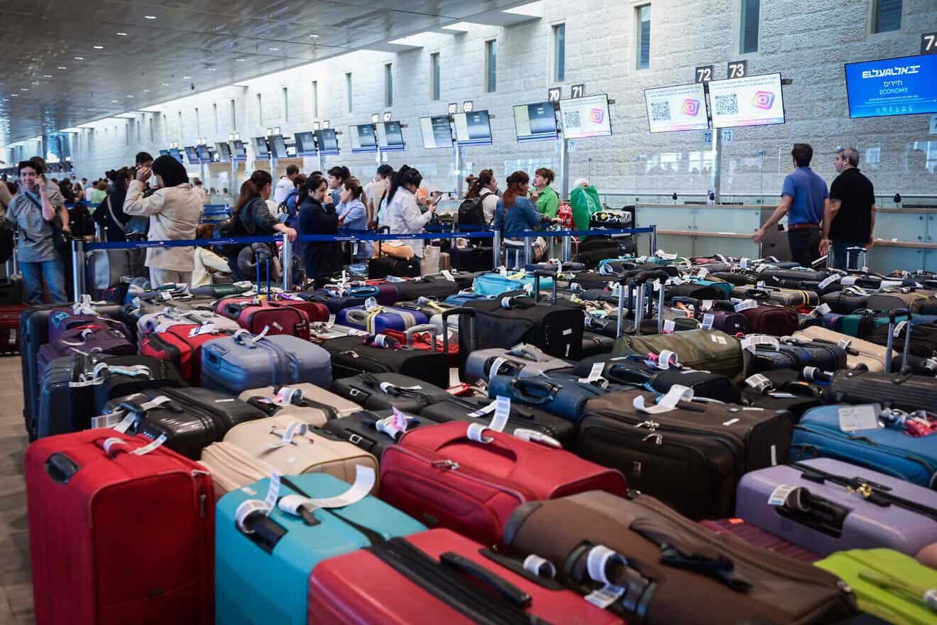 Travellers at Ben Gurion International Airport where flights were being delayed, as the workers of the airport went on strike, in a protest for the release of Israelis held hostage by Hamas terrorists in Gaza, on Sept. 2, 2024. Photo by Avshalom Sassoni/Flash90.