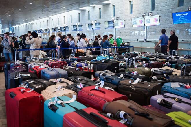 Travellers at Ben Gurion International Airport where flights were being delayed, as the workers of the airport went on strike, in a protest for the release of Israelis held hostage by Hamas terrorists in Gaza, on Sept. 2, 2024. Photo by Avshalom Sassoni/Flash90.