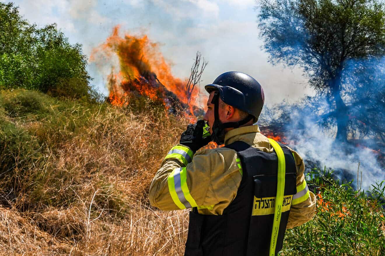 Firefighters at the site of a wildfire following a missiles attack from Lebanon, near Kibbutz Snir, northern Israel, September 16, 2024. Photo by Ayal Margolin/Flash90.