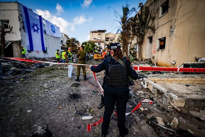Israeli security and rescue forces at the site where a Hezbollah rocket fired from Lebanon hit homes and cars in the Haifa suburb of Kiryat Bialik, Sept. 22, 2024. Photo by Chaim Goldberg/Flash90.