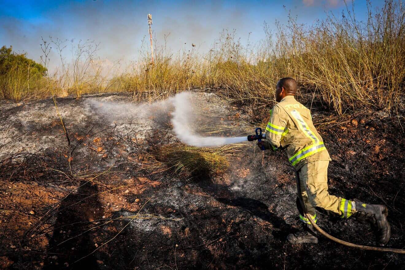 A firefighter after a Yemeni missile hit near Moshav Kfar Daniel, between Modi'in and Ben-Gurion Airport, Sept. 15, 2024. Photo by Yossi Aloni/Flash90.