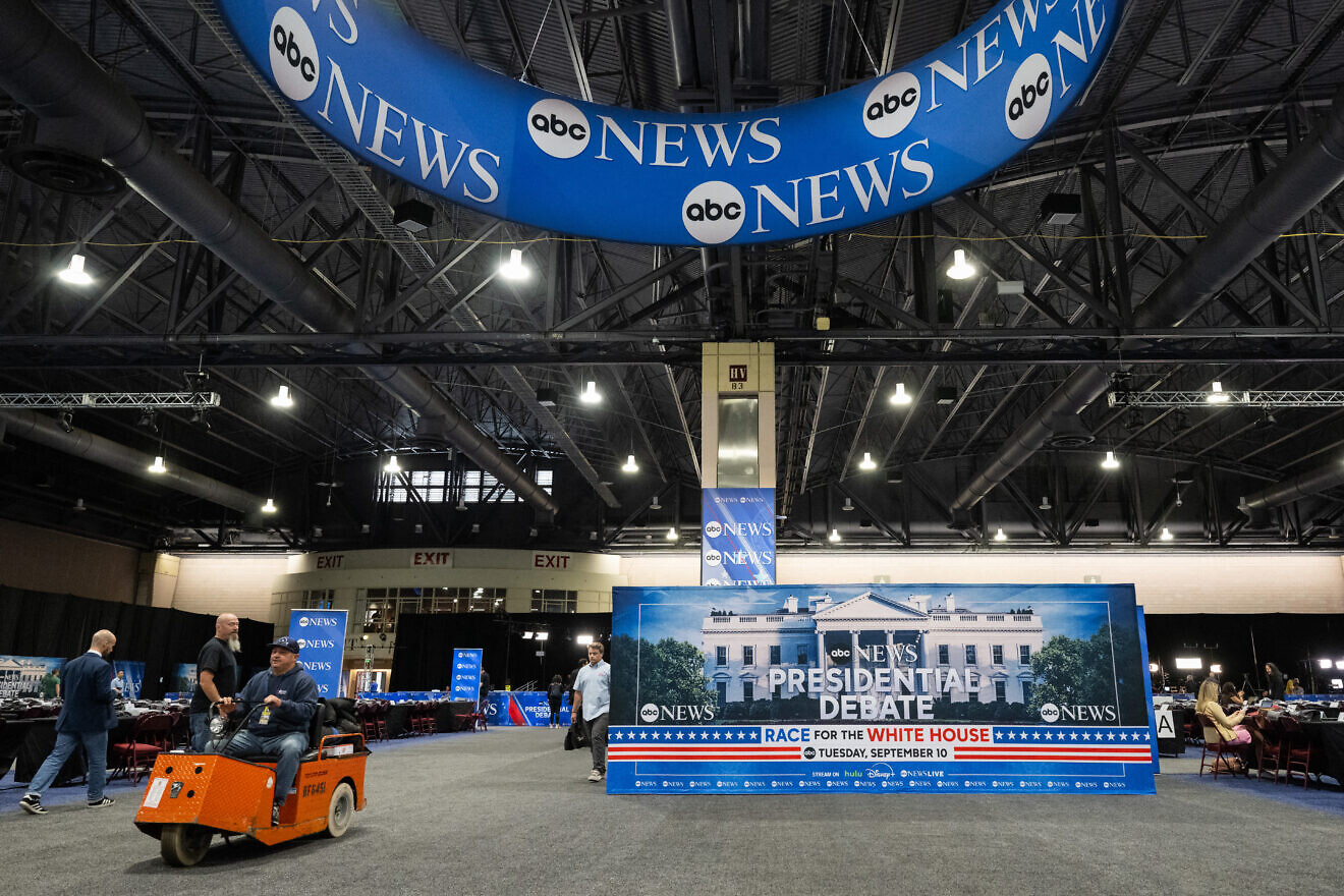 Workers complete preparations on the media filing center and spin room for the ABC News presidential debate between Democratic candidate Vice President Kamala Harris and Republican candidate former U.S. President Donald Trump, in Philadelphia on Sept. 9, 2024. Photo by Saul Loeb/AFP via Getty Images.
