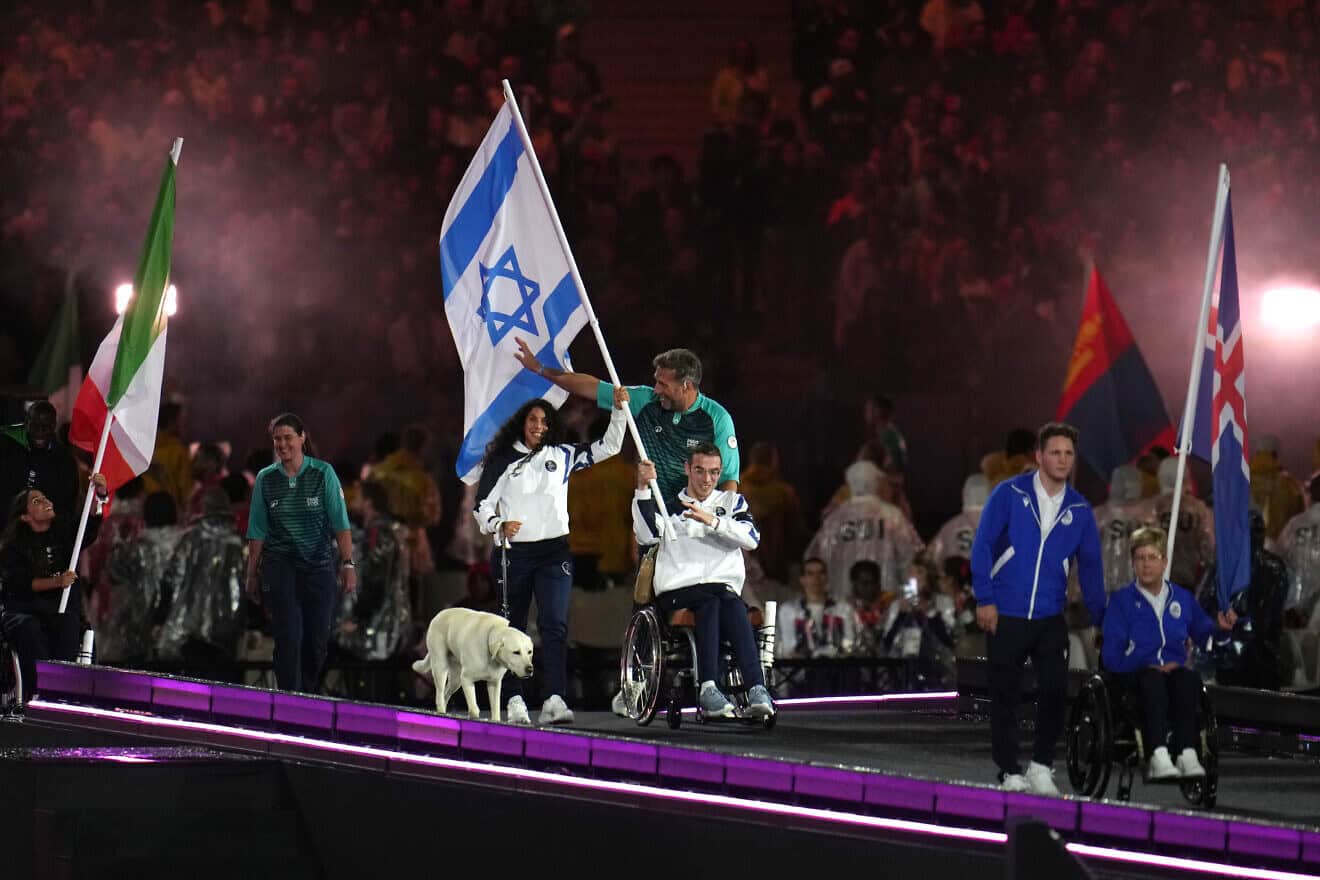 Ami Omer Dadaon and Gal Hamrani, Flag Bearers of Team Israel, parade with their national flag during the closing ceremony on day eleven of the Paris 2024 Summer Paralympic Games at Stade de France on Sept. 8, 2024 in Paris, France. Photo by Aitor Alcalde/Getty Images for IPC.